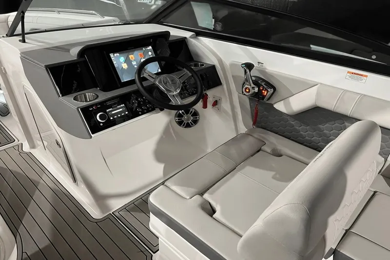 Slide: The Image of 2024 Sea Ray SDX 290 helm with modern controls, touchscreen display, and comfortable seating. - 8