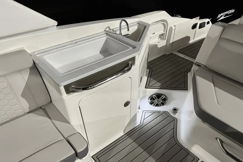 Slide: The Image of 2024 Sea Ray SDX 290 boat interior with sink, seating, and non-slip flooring. - 9