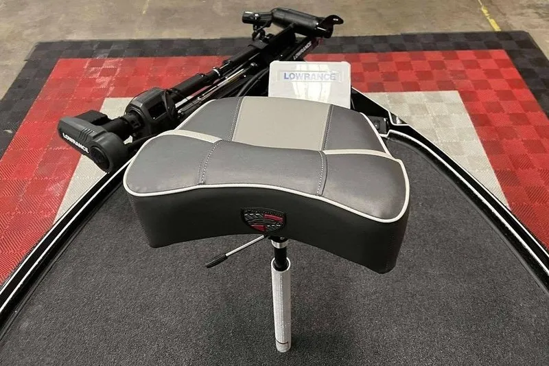 Slide: The Image of Triton 20XP Patriot 2026 boat seat with Lowrance equipment on red and black checkered floor. - 9