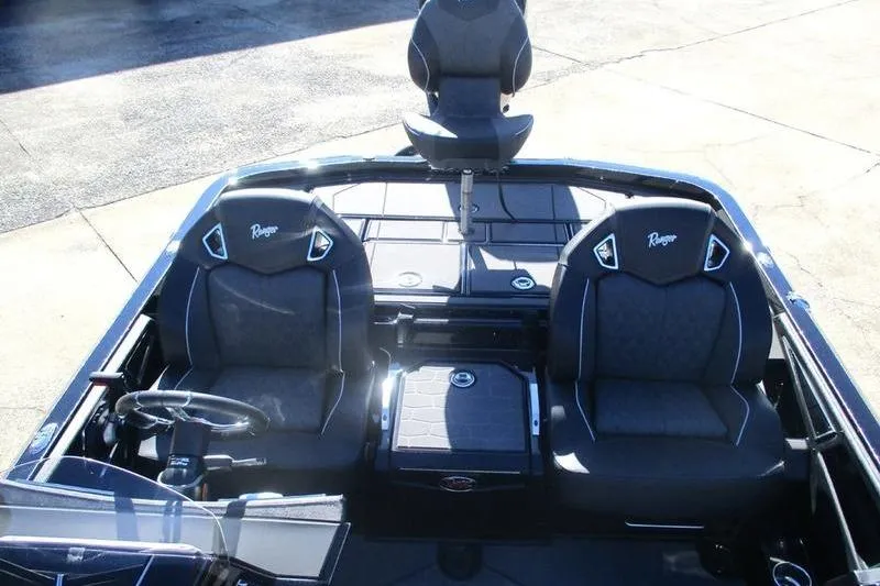 Slide: The Image of 2026 Ranger Z521R Cup-Equipped boat interior with three seats and steering wheel. - 10