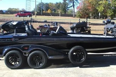 Slide: The Image of 2026 Ranger Z521R Cup-Equipped boat with sleek black design and triple-axle trailer. - 4