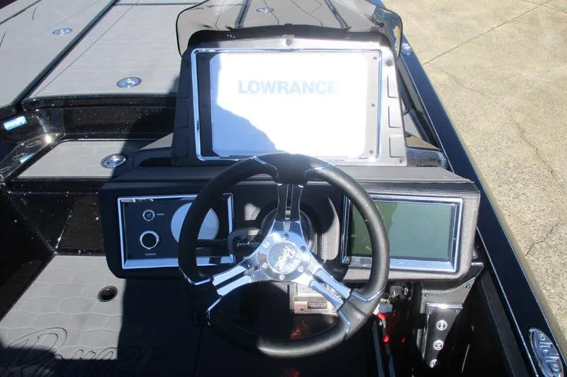 Slide: The Image of 2026 Ranger Z521R Cup-Equipped boat dashboard with Lowrance display and steering wheel. - 5