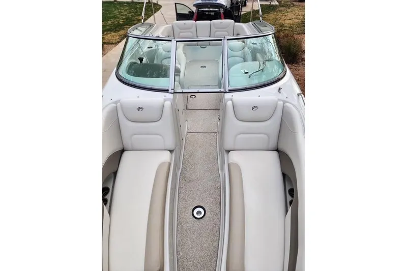 Slide: The Image of 2008 Crownline 270 BR boat interior with white seating and open bow design. - 19