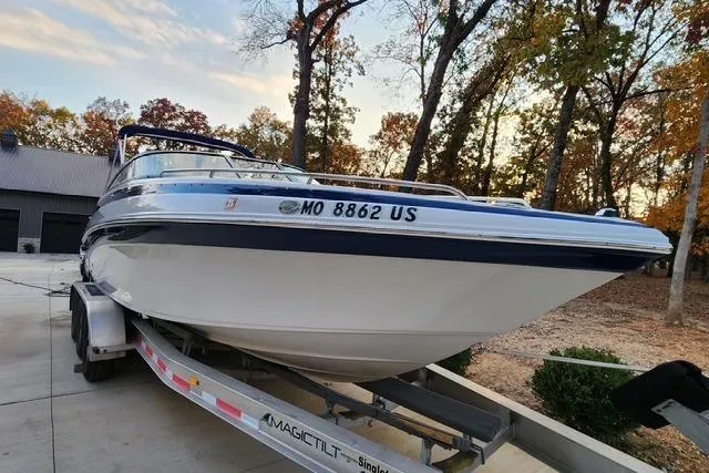 Slide: The Image of 2008 Crownline 270 BR boat on trailer, surrounded by autumn trees. - 5
