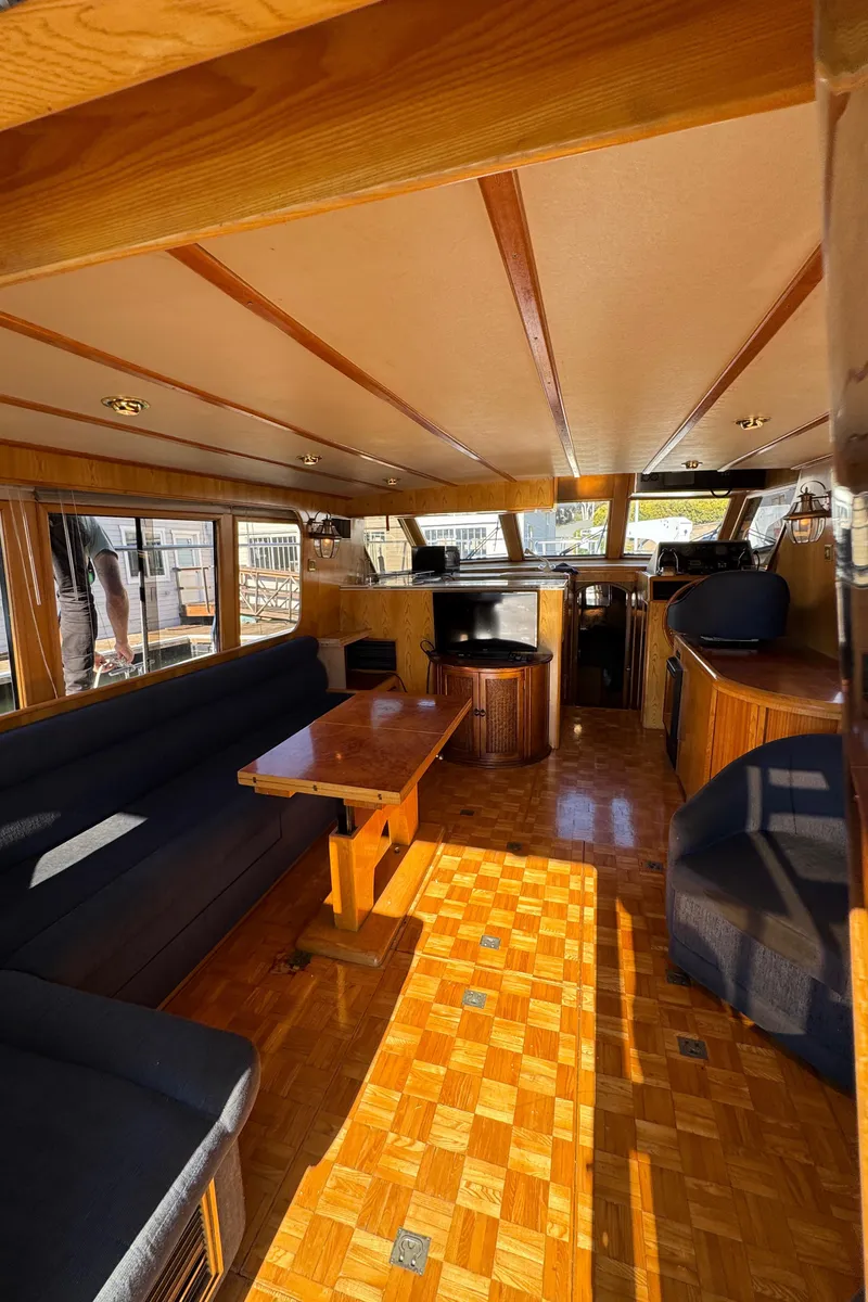 Slide: The Image of Interior of 1991 Ocean Alexander 46 yacht with wooden finishes and comfortable seating. - 34