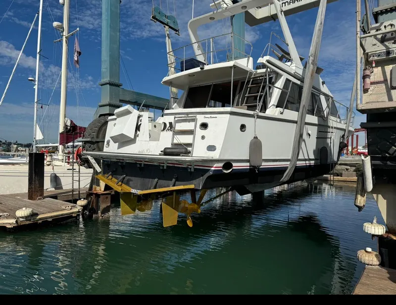 Slide: The Image of Ocean Alexander 46 yacht from 1991 being lifted at a marina. - 4