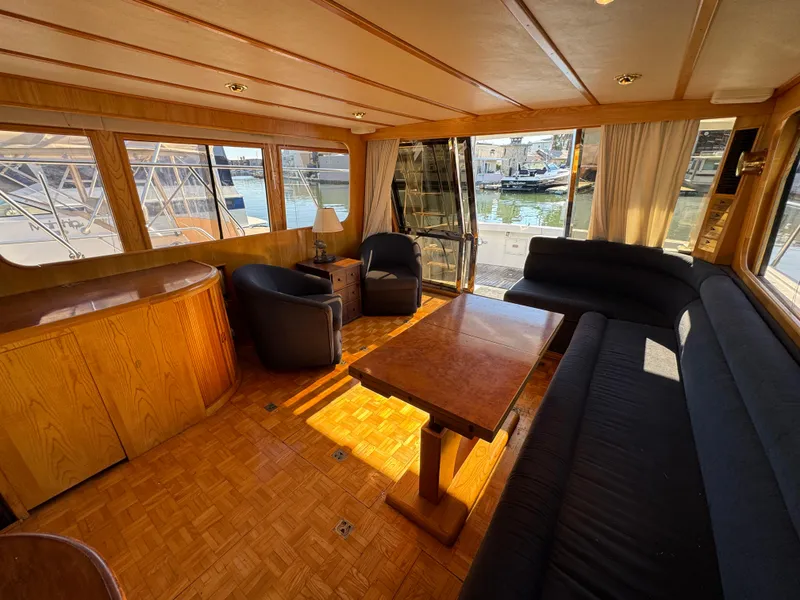 Slide: The Image of Luxurious interior of a 1991 Ocean Alexander 46 yacht with elegant wood finishes. - 8