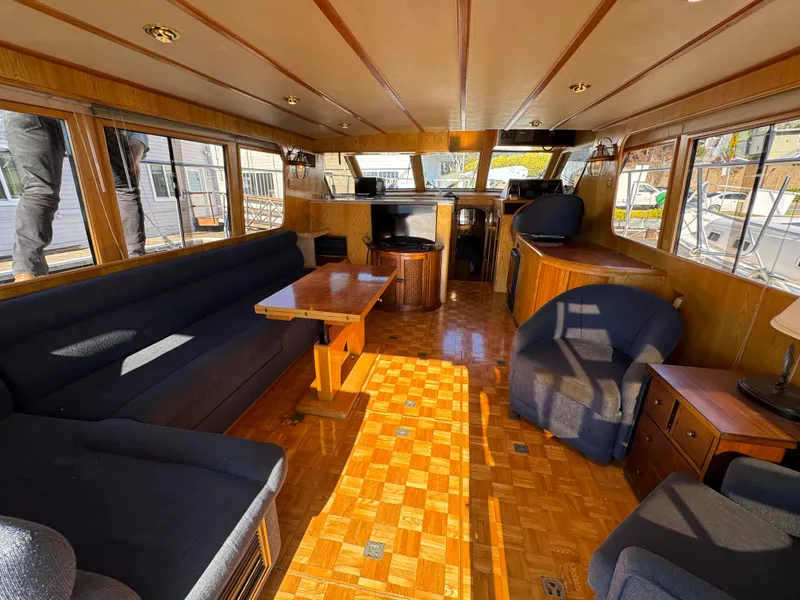 Slide: The Image of Luxurious interior of a 1991 Ocean Alexander 46 yacht with elegant wood finishes. - 9