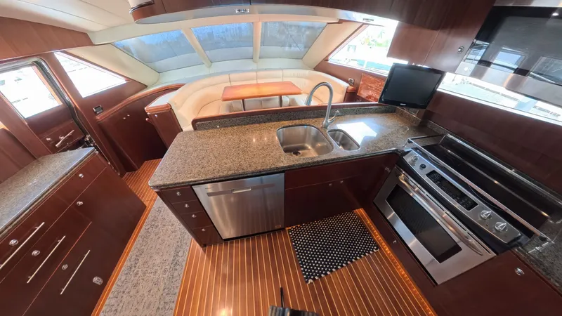 The Image of Luxurious 2009 Horizon Vision yacht kitchen with granite countertops and modern appliances. - 0