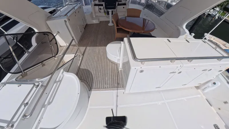 Slide: The Image of Spacious deck of 2009 Horizon Vision yacht with seating and wooden flooring. - 3