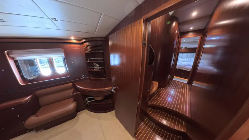 Slide: The Image of Luxurious interior of 2009 Horizon Vision yacht with wood paneling and cozy seating area. - 31