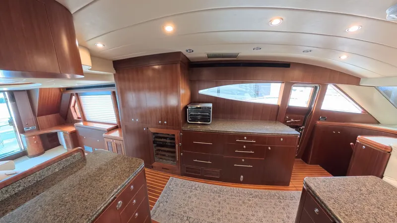 Slide: The Image of Luxurious 2009 Horizon Vision yacht interior with elegant wood cabinetry and granite countertops. - 34