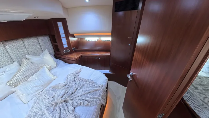 Slide: The Image of Luxurious cabin interior of 2009 Horizon Vision yacht with cozy bedding and wooden finishes. - 38