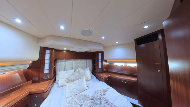 Slide: The Image of Luxurious cabin interior of 2009 Horizon Vision yacht with elegant wood finish and cozy bedding. - 39