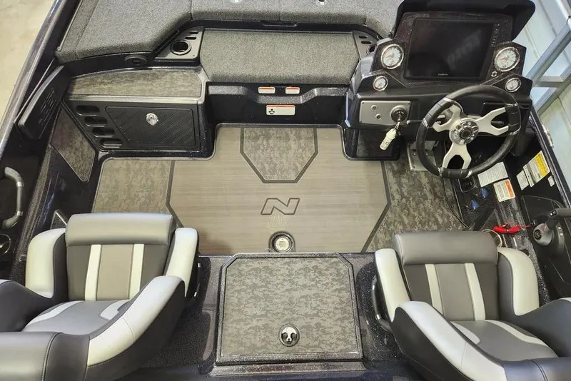 Slide: The Image of 2025 Nitro Z21 XL Pro boat interior with modern dashboard and dual seating. - 11