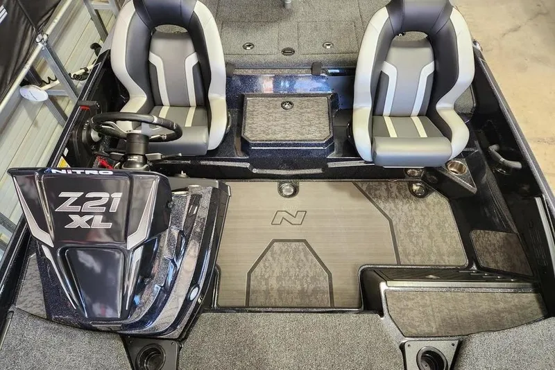 Slide: The Image of 2025 Nitro Z21 XL Pro boat interior with dual seats and steering console. - 12