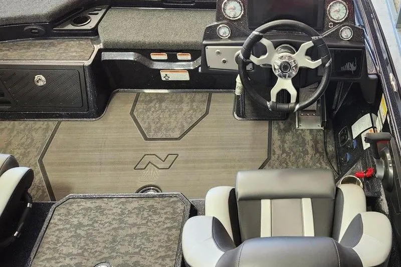 Slide: The Image of 2025 Nitro Z21 XL Pro boat interior with steering wheel and seating. - 4
