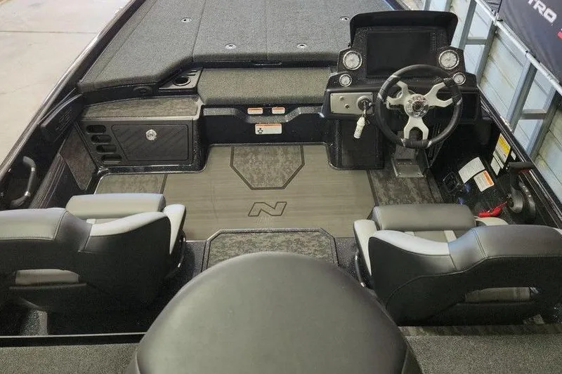 Slide: The Image of 2025 Nitro Z21 XL Pro boat interior with steering wheel and seating. - 7