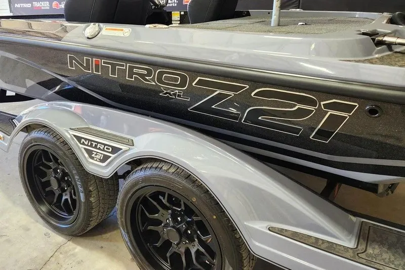Slide: The Image of 2025 Nitro Z21 XL Pro boat with sleek design and black wheels. - 8
