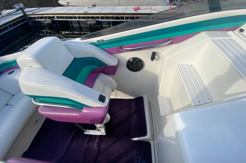 Slide: The Image of Luxury seating on 1999 Black Thunder XT 430 SC boat with vibrant upholstery. - 14