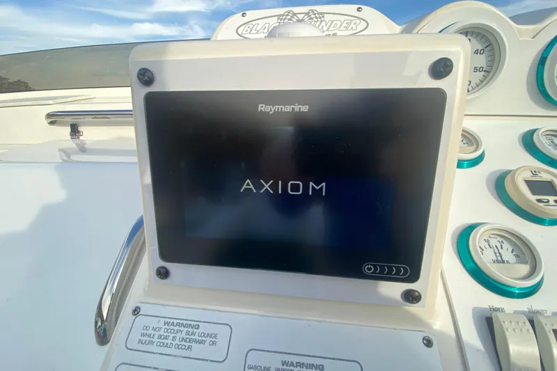 Slide: The Image of Raymarine Axiom display on 1999 Black Thunder XT 430 SC boat dashboard. - 18