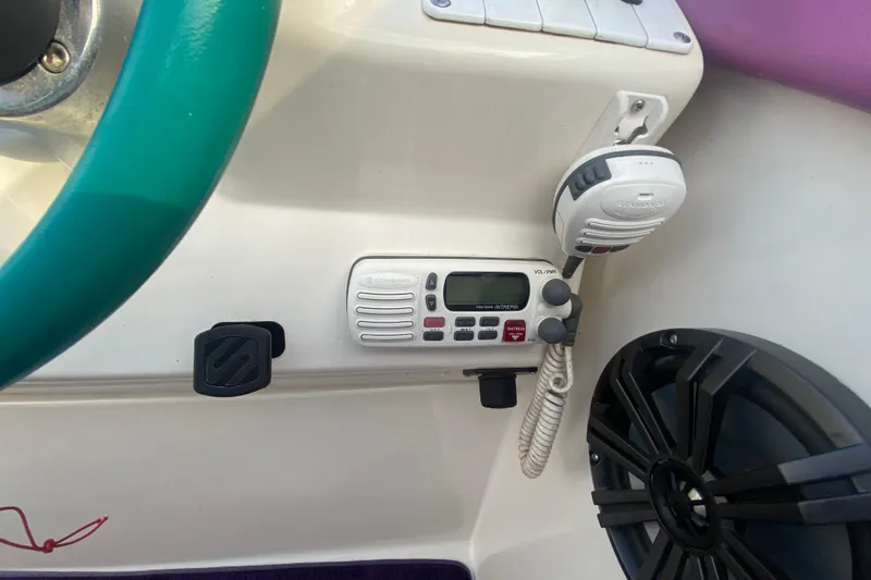 Slide: The Image of 1999 Black Thunder XT 430 SC dashboard with radio and speaker system. - 20