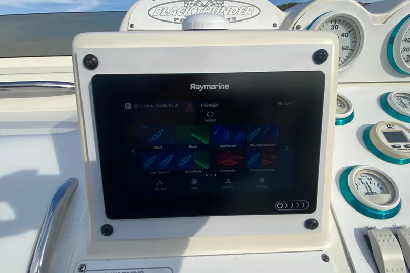 Slide: The Image of Raymarine navigation display on 1999 Black Thunder XT 430 SC boat dashboard. - 24