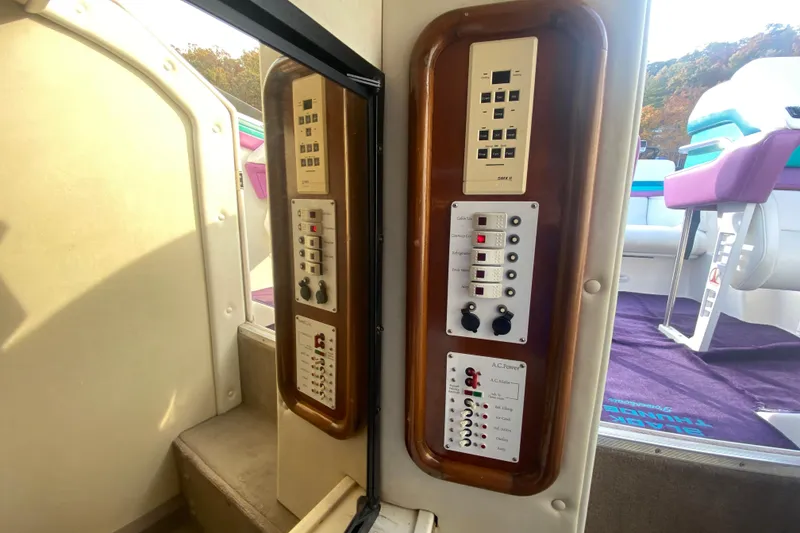 Slide: The Image of Interior view of 1999 Black Thunder XT 430 SC boat with control panels. - 27