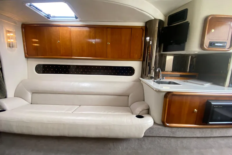Slide: The Image of Luxurious interior of 1999 Black Thunder XT 430 SC with leather seating and wooden cabinetry. - 34