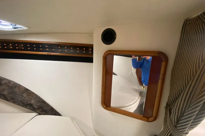 Slide: The Image of 1999 Black Thunder XT 430 SC cabin interior with mirror and seating area. - 37