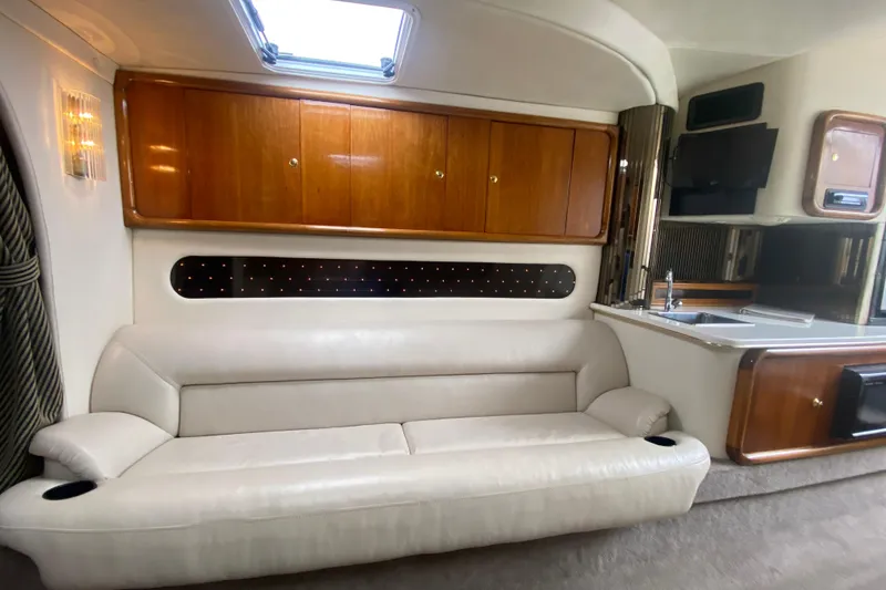 Slide: The Image of Luxurious interior of 1999 Black Thunder XT 430 SC boat with leather seating and wood cabinets. - 39