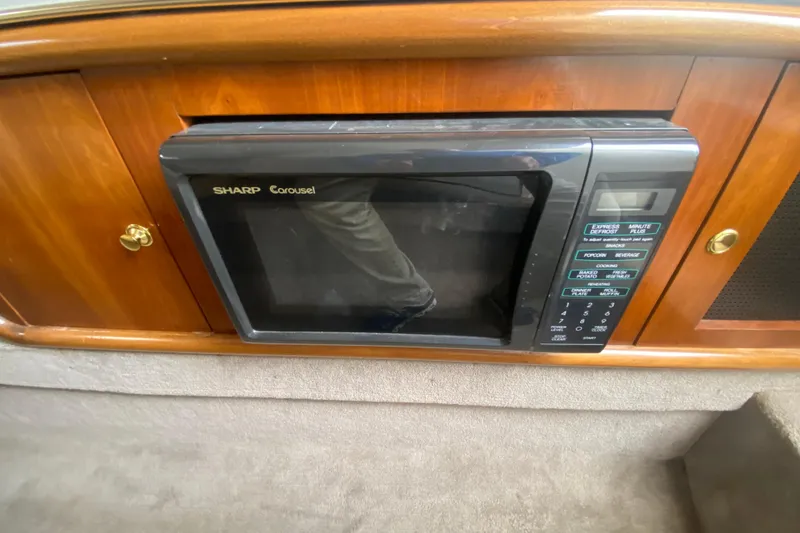 Slide: The Image of Sharp Carousel microwave in 1999 Black Thunder XT 430 SC boat interior. - 41