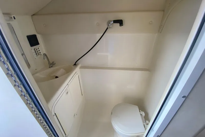 Slide: The Image of 1999 Black Thunder XT 430 SC boat bathroom with sink, shower, and toilet. - 42