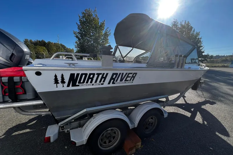 Slide: The Image of 2008 North River 18 SEA HAWK boat on trailer, sunny day, trees in background. - 4