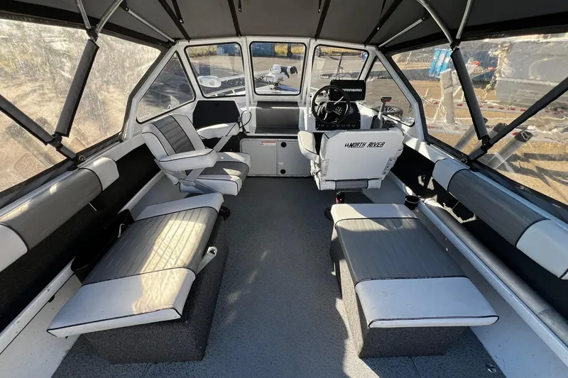 Slide: The Image of Interior of a 2008 North River 18 SEA HAWK boat with seating and steering console. - 6