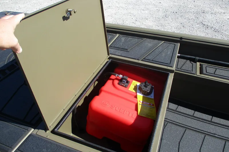 Slide: The Image of Open storage compartment in 2026 Gator Tail 1860 Extreme boat, revealing red fuel tank. - 11