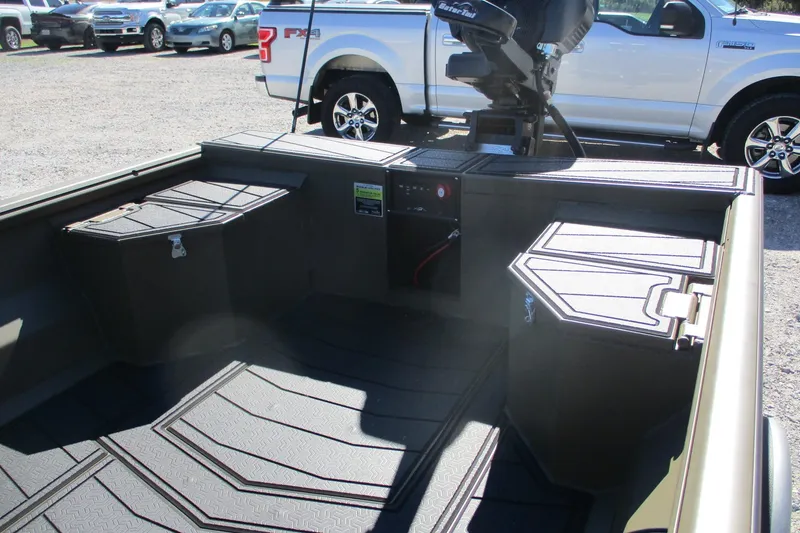Slide: The Image of 2026 Gator Tail 1860 Extreme boat interior with storage compartments and motor. - 12