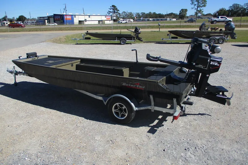 Slide: The Image of 2026 Gator Tail 1860 Extreme boat on trailer in outdoor setting. - 2