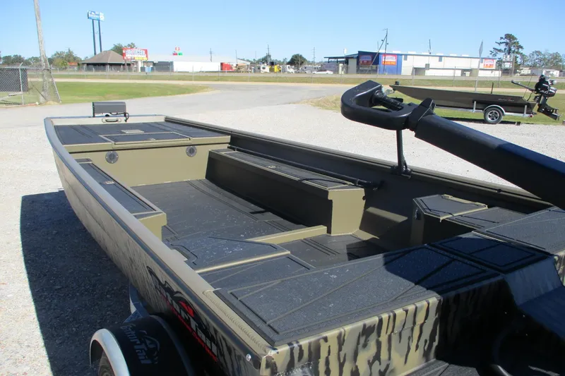 Slide: The Image of 2026 Gator Tail 1860 Extreme boat on trailer, parked outdoors. - 7