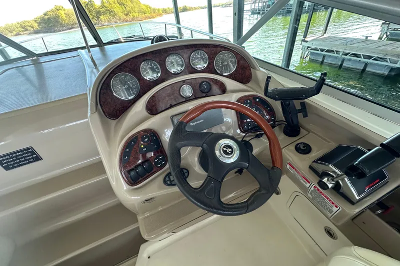 Slide: The Image of 2005 Sea Ray 280 Sundancer swim platform with ladder, docked in marina. - 11