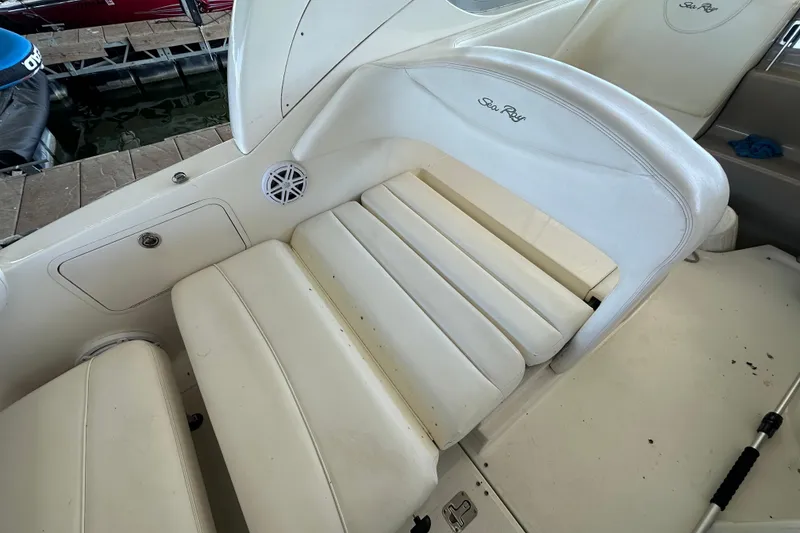 Slide: The Image of Interior of 2005 Sea Ray 280 Sundancer with cozy seating and wooden table. - 12