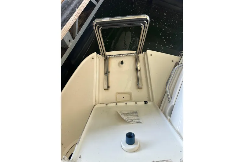 Slide: The Image of Interior of 2005 Sea Ray 280 Sundancer with cozy dining area and wooden table. - 13