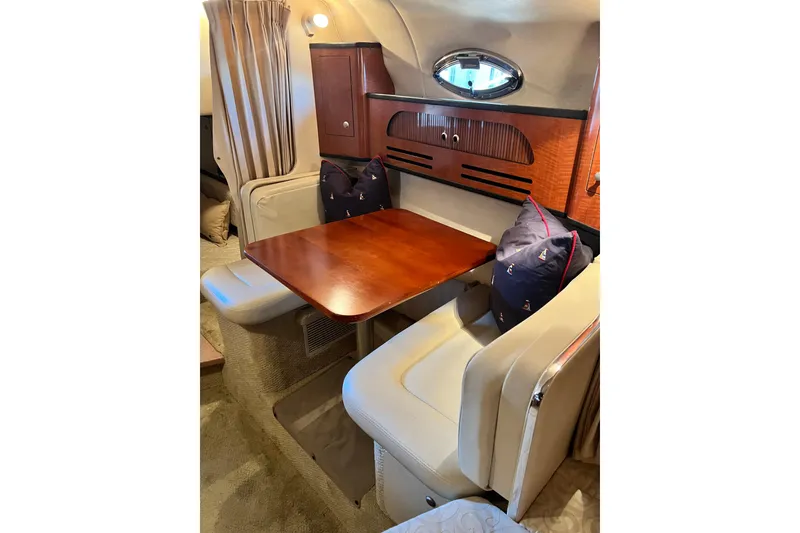 Slide: The Image of Compact kitchen area in a 2005 Sea Ray 280 Sundancer boat with sink and microwave. - 15