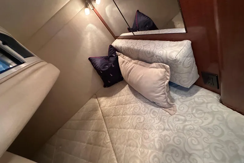 Slide: The Image of Compact bathroom in 2005 Sea Ray 280 Sundancer boat with sink and toilet. - 24