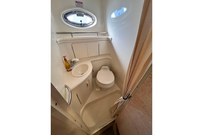 Slide: The Image of Open mini fridge inside 2005 Sea Ray 280 Sundancer boat cabin. - 26