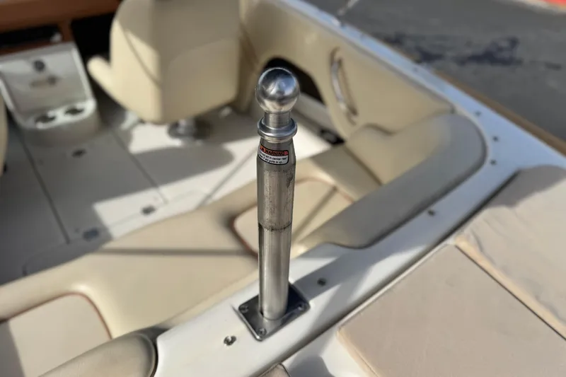 Slide: The Image of 2005 Chris-Craft Speedster interior with beige seating and metal fixture. - 13