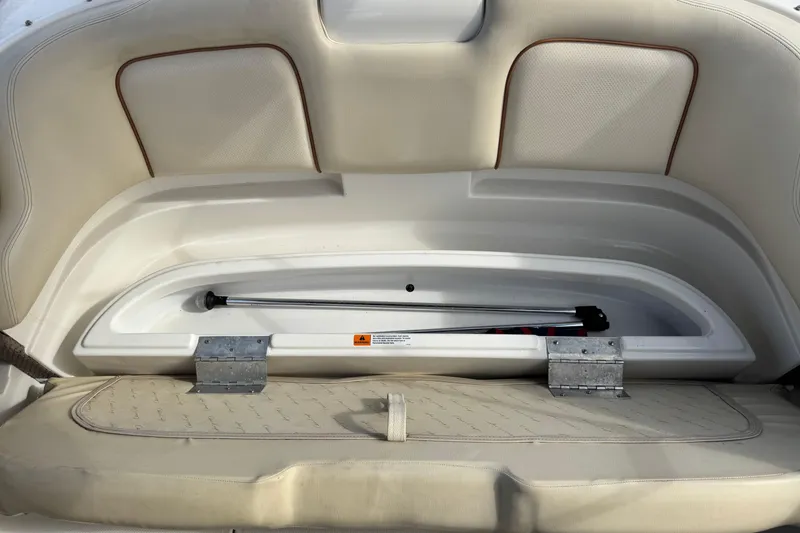 Slide: The Image of 2005 Chris-Craft Speedster boat interior storage compartment with beige upholstery. - 15