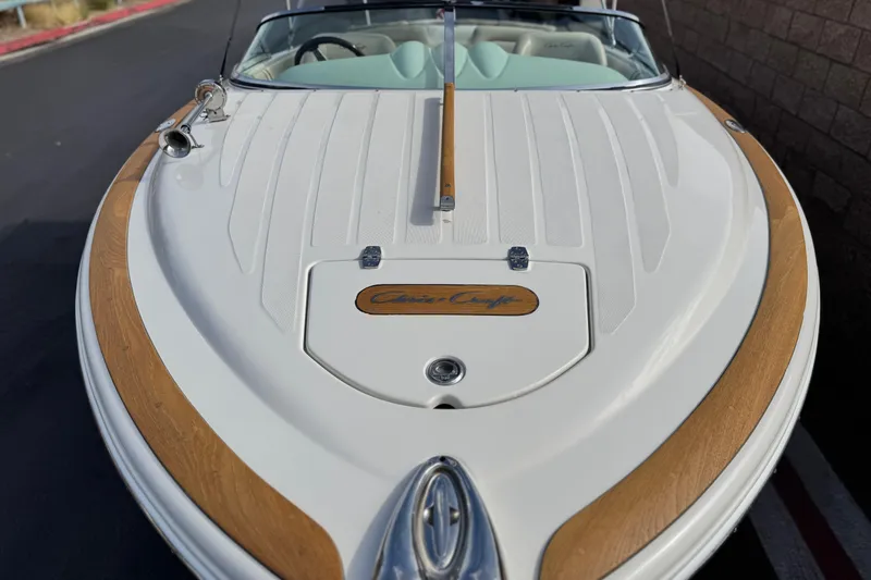 Slide: The Image of 2005 Chris-Craft Speedster boat with sleek design and wood accents. - 8