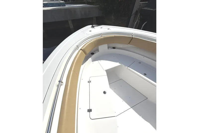 Slide: The Image of 2023 Sportsman Open 352 Center Console boat interior with tan seating and white deck. - 10