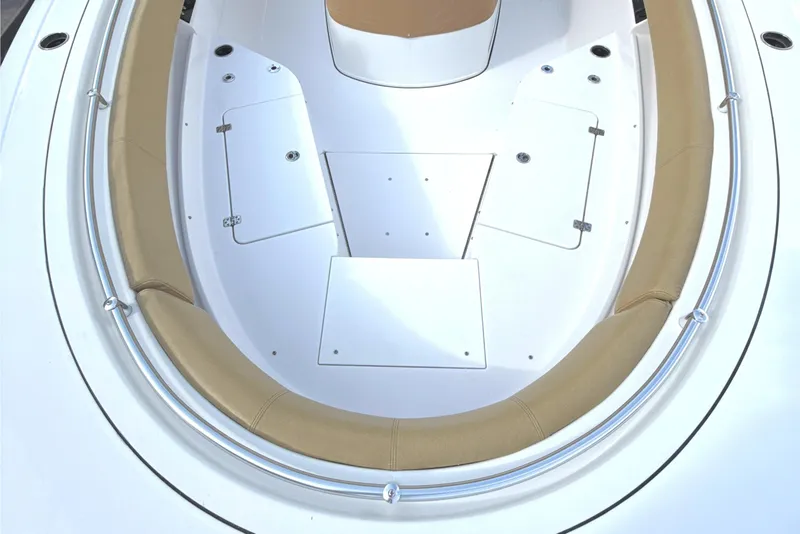 Slide: The Image of 2023 Sportsman Open 352 Center Console boat with tan seating and storage compartments. - 11